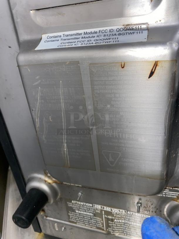 MerryChef Eikon E2S high-speed cook oven, black, electric, countertop model. FCC and IC module labels visible. Used condition.