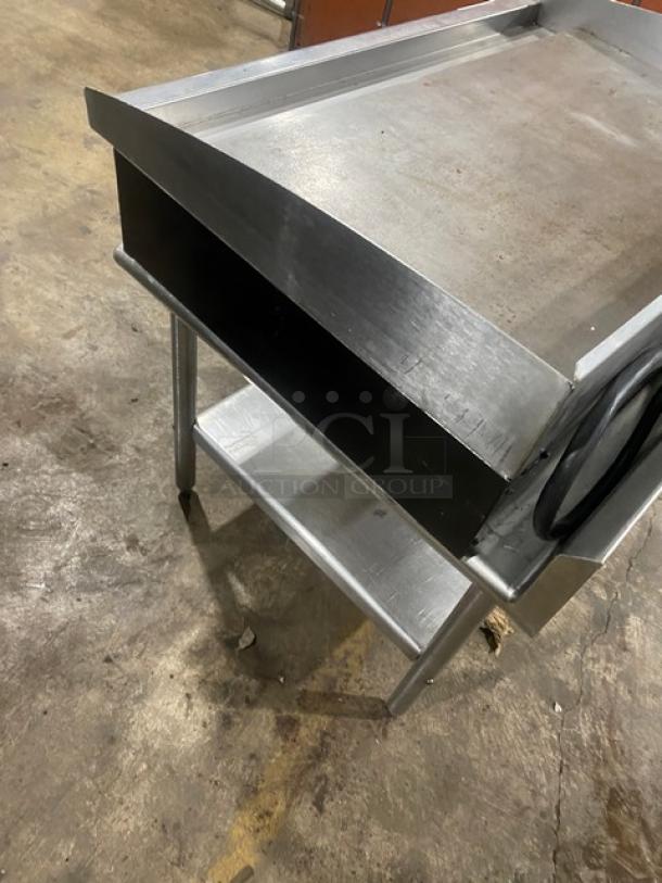 Star Commercial stainless steel electric countertop griddle with back and side splash, single undershelf stand, on legs.