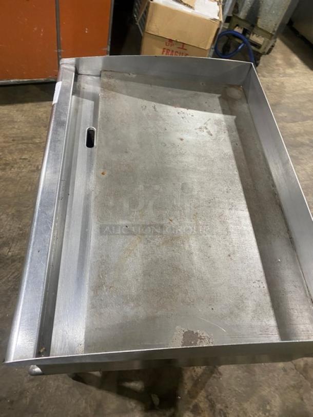 Star stainless steel electric countertop flat griddle with back and side splash, single undershelf equipment stand, on legs.