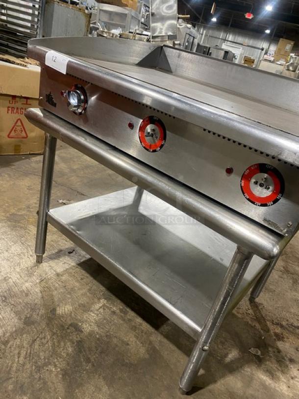 Star commercial stainless steel electric flat griddle with back and side splash, single undershelf, on legs, excellent condition.