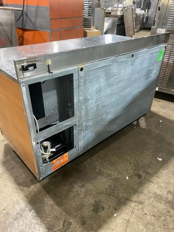 Duke RBC60M stainless steel bar back refrigerator, wooden style, 2 doors, upturned backsplash, on legs, 120V, SN: 09135680.