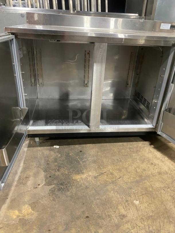 Duke RBC60M stainless steel 2-door bar refrigerator on legs, wooden style finish, upturned backsplash, model number 09135680.