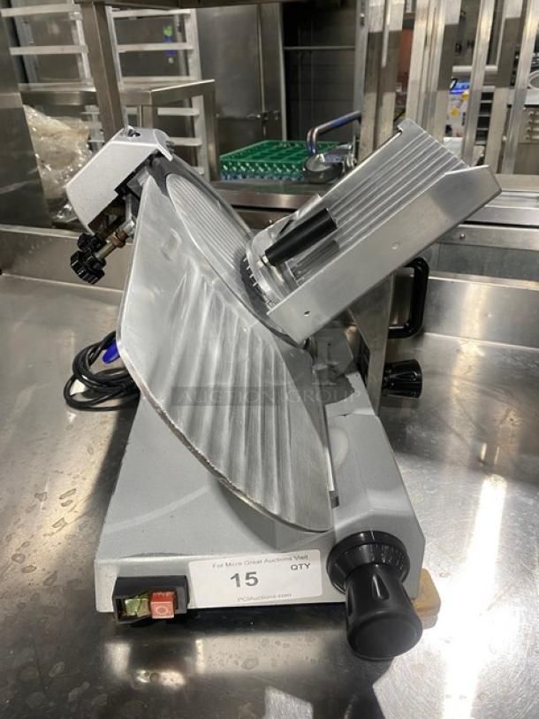 Commercial electric countertop deli meat slicer, gray metal, adjustable thickness knob, power switch, good condition.