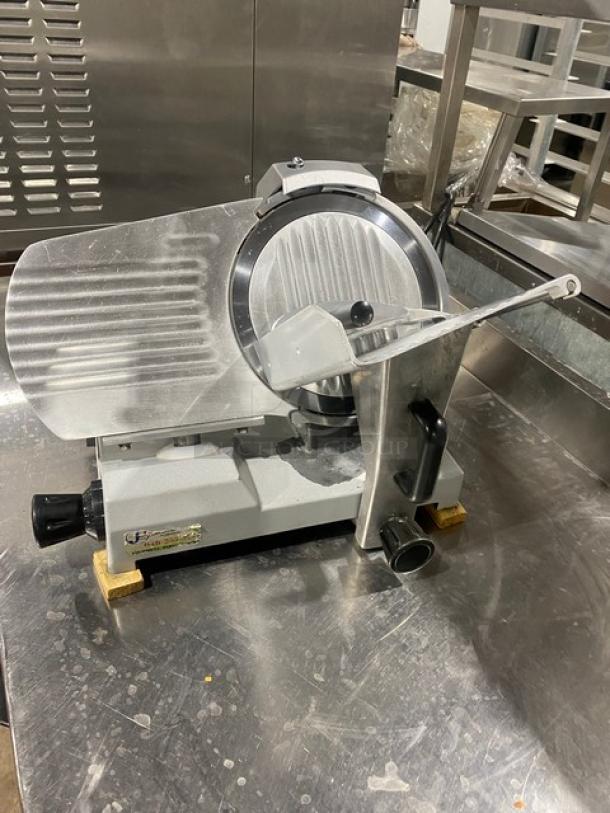 Commercial electric countertop deli meat slicer, silver, stainless steel blade, adjustable thickness, good condition.