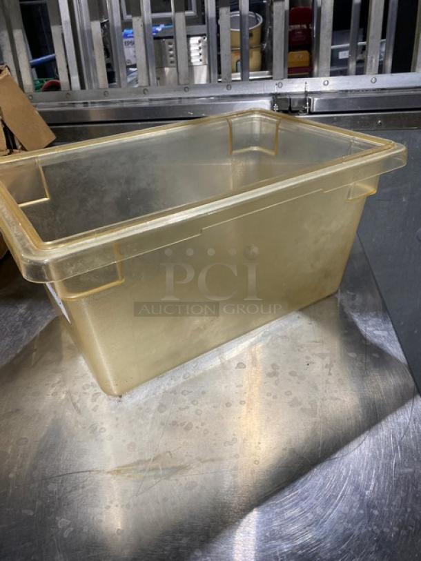 Commercial amber food storage container, rectangular, transparent, used condition. Perfect for bulk food management.