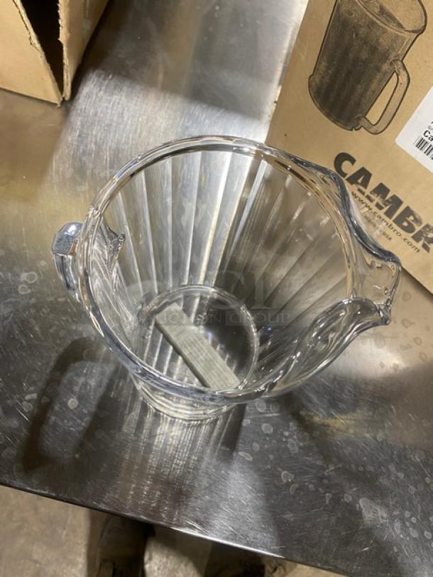 Brand new Cambro Camwear 60 oz. clear beverage serving pitcher, model P60CW135, commercial use, pristine condition.
