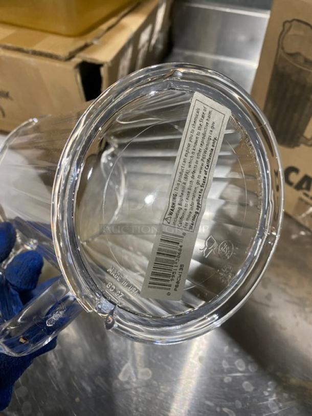 Cambro Camwear Series 60 oz. clear pitcher, model P60CW135, new condition, visible barcode and warning label.