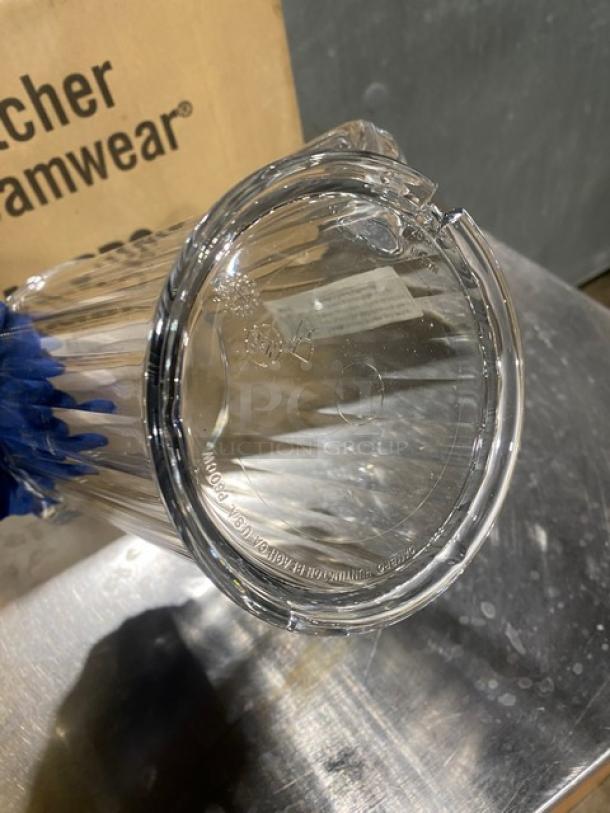Brand new Cambro Camwear Series clear 60 oz. beverage serving pitcher, model P60CW135, shown clean and pristine.