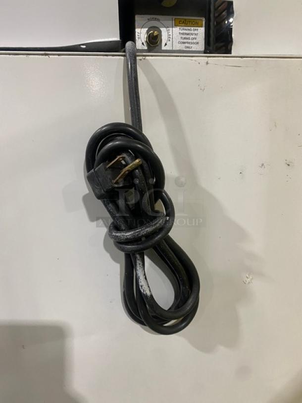 Leer Commercial Ice Merchandiser Freezer, Model 301UC25MG, with single glass swing door. Serial Number: HAA-0404. Cord visible.