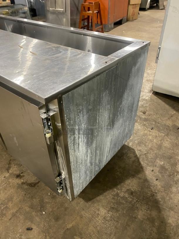 Leader Commercial Stainless Steel 3 Door Refrigerated Prep Table, poly coated wired rack, on casters, 115V 1 Phase.