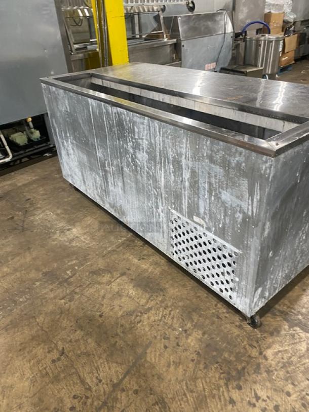 Leader Commercial 3-Door Stainless Steel Refrigerated Salad/Sandwich Prep Table, features poly-coated wired rack, on casters.