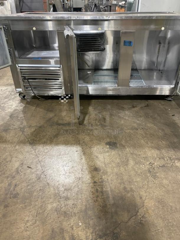 Leader stainless steel 3-door refrigerated prep table on casters, poly-coated wire rack, 115V 1 Phase, commercial use.