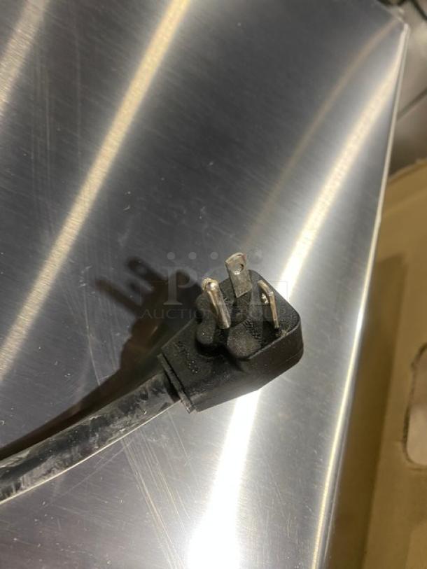 Menumaster RFS12TSW countertop microwave plug, stainless steel surface, 120V, new condition, digital controls.