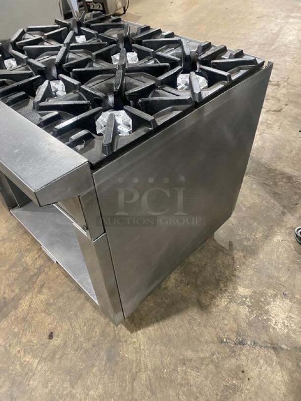 U.S. Range commercial 6-burner stainless steel range with enclosed cabinet base, natural gas powered, on casters, excellent condition.