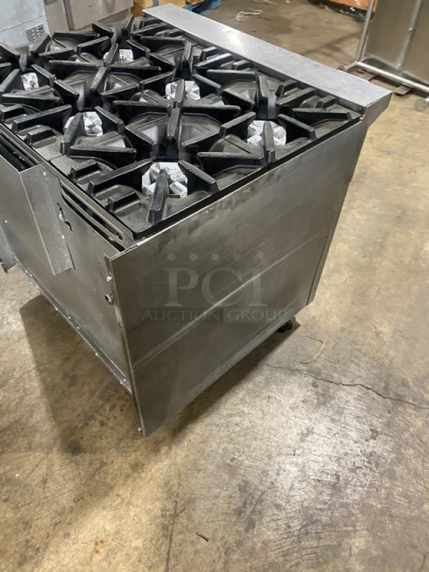 U.S. Range Commercial 6 Burner Stainless Steel Gas Range with dry cabinet-style base on casters, excellent condition.