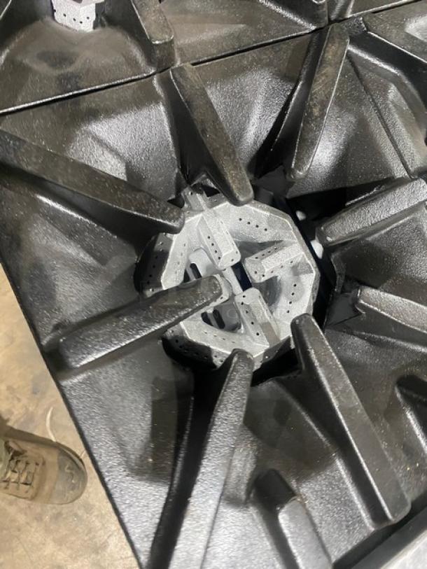 U.S. Range 6 burner commercial stainless steel stove, natural gas, with dry cabinet-style base, on casters, excellent condition.