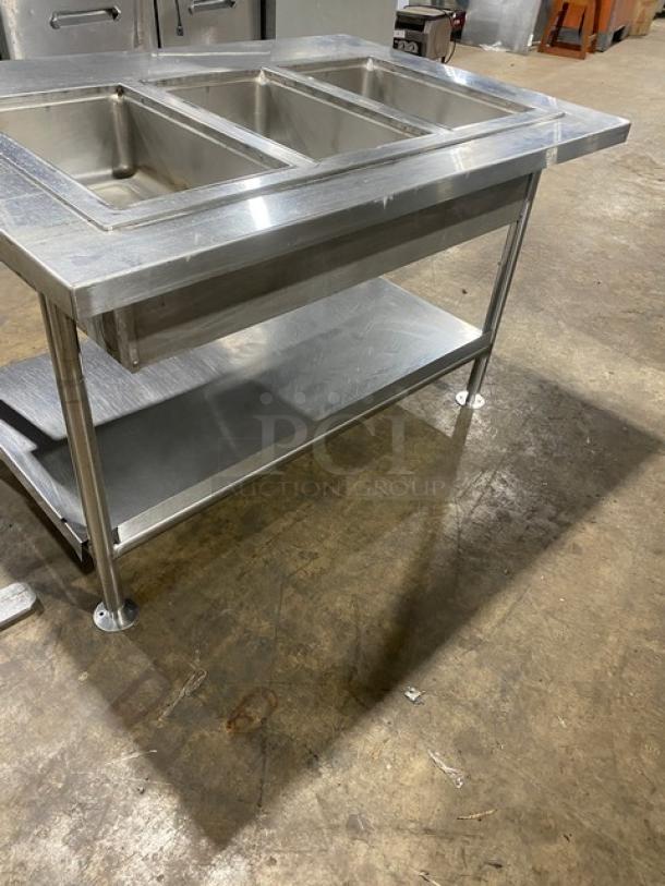 Wells MOD300TDM stainless steel 3-well hot food steamtable, electric, with undershelf, on legs, model SN: M3TD0616A0016.