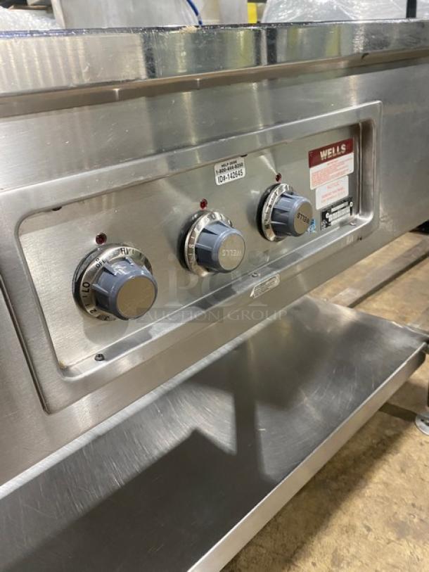 Wells MOD300TDM stainless steel electric steamtable, 3 wells, single undershelf, visible control dials, 208/240V, on legs.