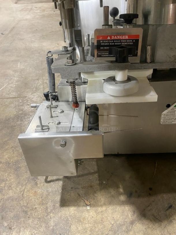 Commercial stainless steel electric burger patty forming machine, 115V 1 Phase, countertop use. Visible safety warning label.