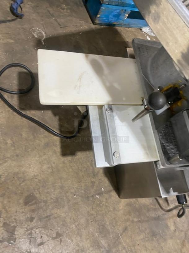 Commercial stainless steel electric burger patty forming machine, 115V, 1-phase, used condition. Countertop model with power cord shown.