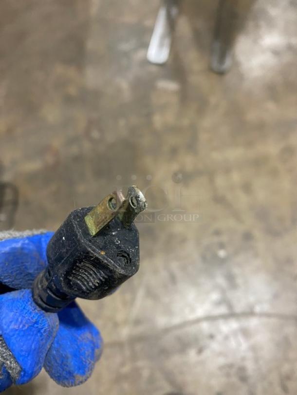 Close-up of a power plug for a commercial stainless steel electric countertop burger forming machine, 115V, 1 phase.