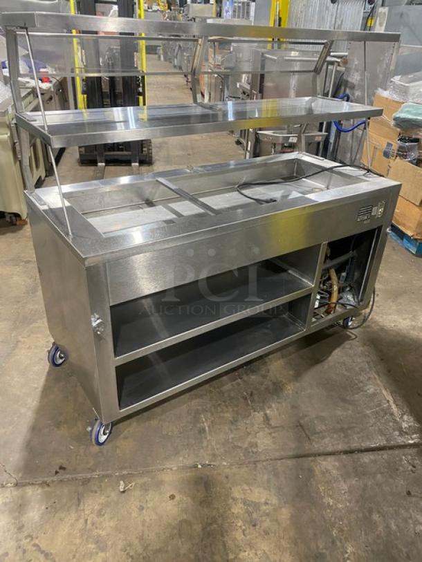 Precision stainless steel cold food salad bar, model SST2024RTNYC, on casters. Features double overhead shelf.
