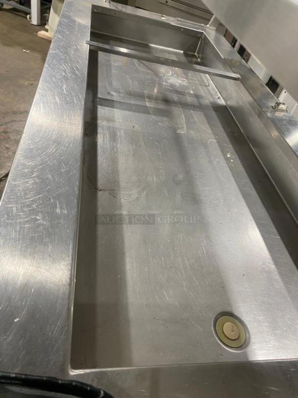 Precision SST-2024-RT-NYC stainless steel refrigerated salad bar with double overhead shelf, on casters, 120V, used condition.