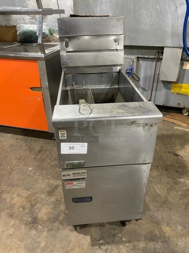 Pitco VF35 stainless steel 35 lb. natural gas deep fryer on casters, with back splash, basket hanger, and fry basket.