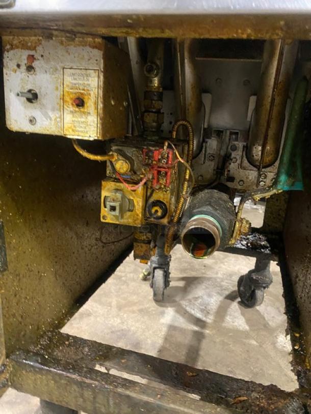 Pitco VF35 commercial stainless steel 35 lb. deep fat fryer, natural gas, with basket hanger, backsplash, and connection hose. On casters.