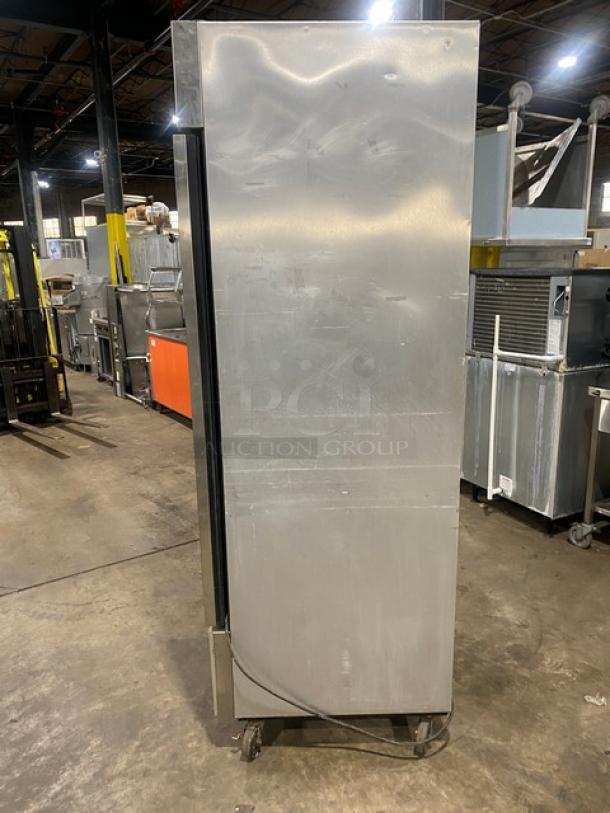 True T-23F commercial stainless steel reach-in freezer, single door, poly-coated wire rack, on casters, 115V.