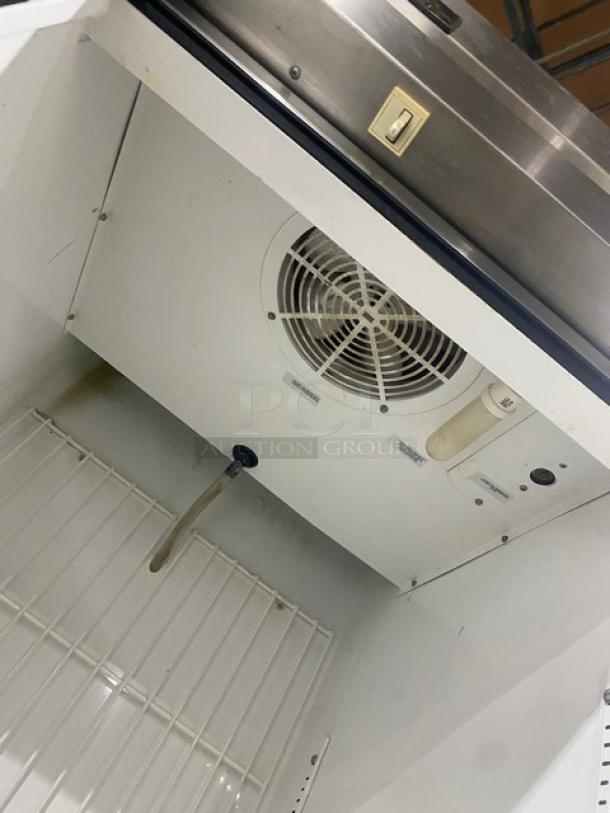 True T-23F stainless steel reach-in freezer interior view, featuring a poly-coated wired rack and visible fan. Serial number 5175087.