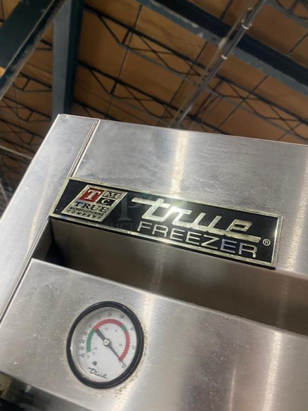 True T-23F Commercial Stainless Steel Single Door Reach-In Freezer with poly-coated rack, gauge, on casters.