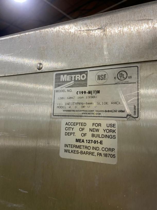 Metro Flavor Hold Series insulated mobile heated cabinet, Model C199H1N, 120V, on casters, with labels indicating NSF and UL approvals.