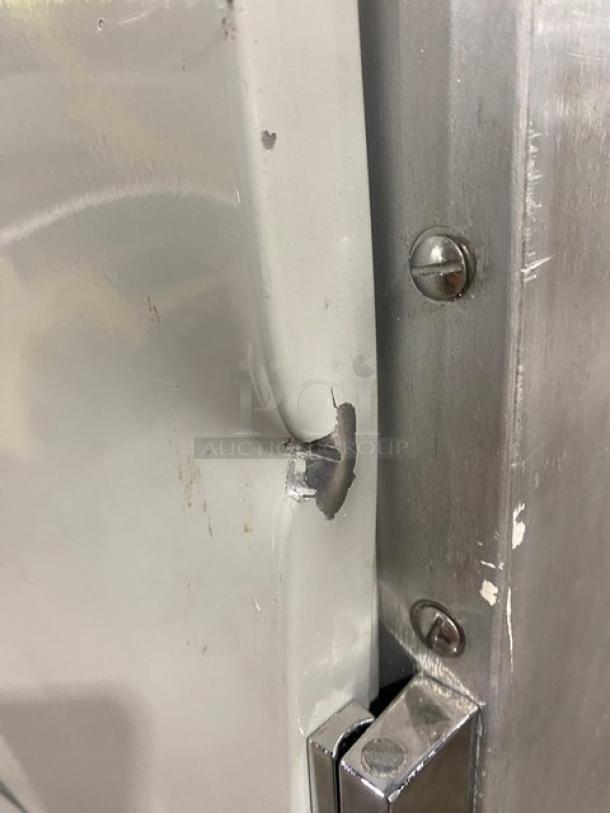 Metro Flavor Hold Series C199H1N insulated cabinet, visible dent and scratch on the door, features pan slides, 120V, on casters.