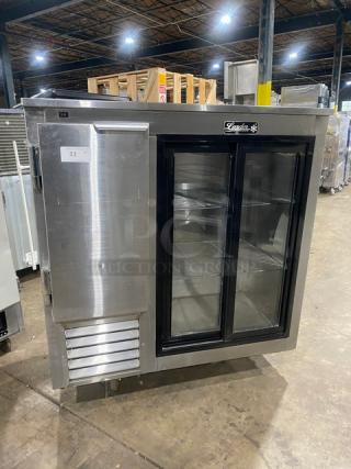 Leader 2018 stainless steel 48" worktop refrigerator, model LB48SC, with double glass sliding doors and chrome wire rack.