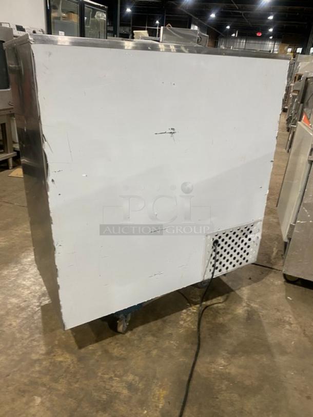Leader 2018 Model LB48SC stainless steel worktop refrigerator. Features double glass sliding doors, chrome rack. Used condition.