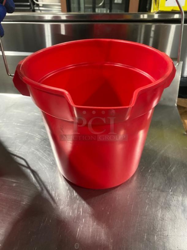 Commercial red round mop bucket with pale-style handle, in excellent condition. Durable plastic material, ideal for utility use.