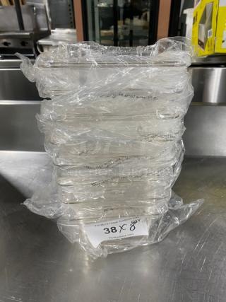 New Winco SP7604 clear polycarbonate 1/6 size 4" deep food pan, sealed pack, model label visible, auction lot tag "38X 8X".