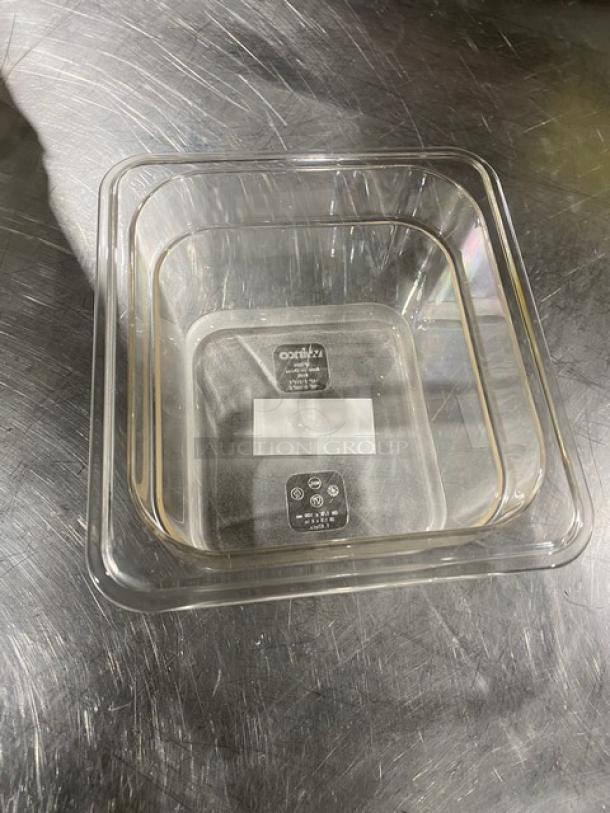 Winco SP7604 clear polycarbonate 1/6 size food pan, 4" deep, new condition. Markings indicate dishwasher safe and NSF certified.