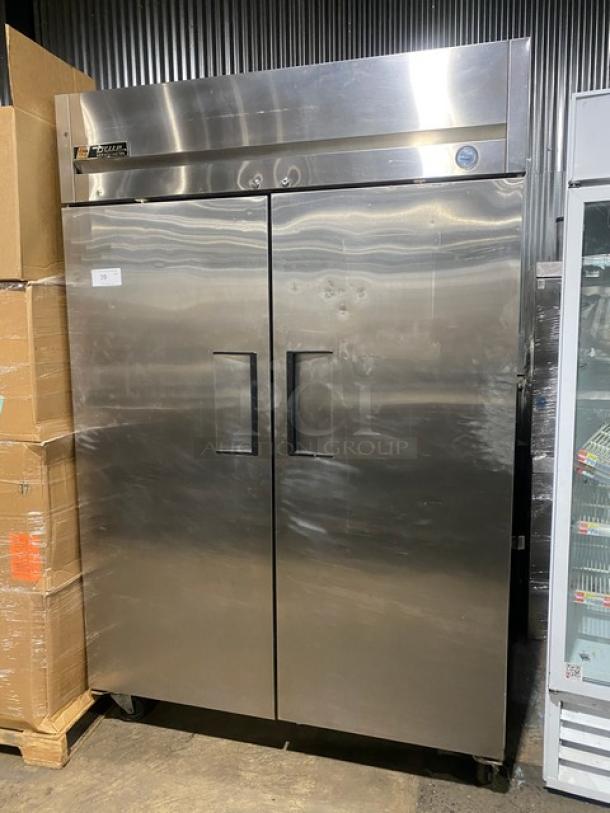 True Commercial Stainless Steel 2 Door Reach-In Refrigerator, Model TM-52, SN: 1-3107073, with poly-coated rack, on casters.