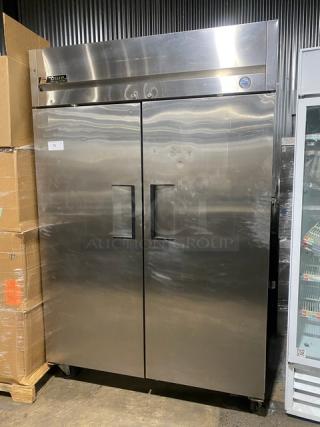 True Commercial Stainless Steel 2 Door Reach-In Refrigerator, Model TM-52, SN: 1-3107073, with poly-coated rack, on casters.