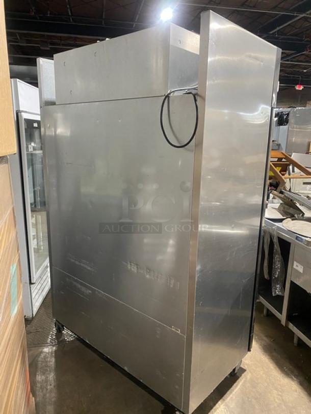 True TM52 commercial stainless steel 2-door reach-in refrigerator, with poly-coated wired rack, SN: 1-3107073.