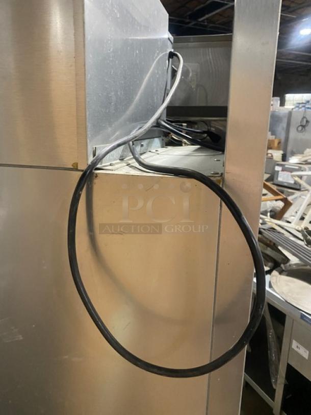 True TM52 stainless steel 2-door refrigerator, poly coated racks, 115V, 1 phase, on casters. Serial: 1-3107073.