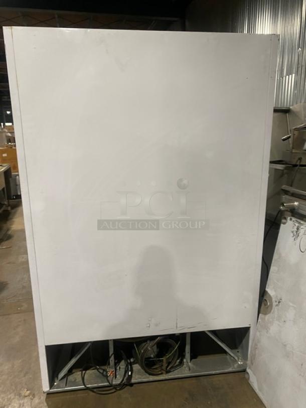 Beverage-Air MT49 commercial refrigerator with double glass swing doors, poly-coated wire racks, 115V, used condition.