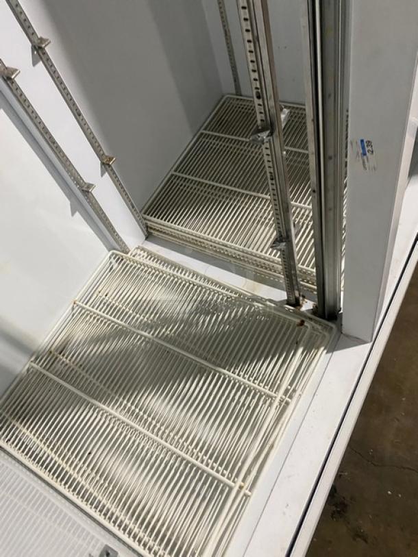 Beverage-Air MT49 commercial refrigerator, double glass swing doors, poly coated wire rack, model MT49, 115V, clean interior.