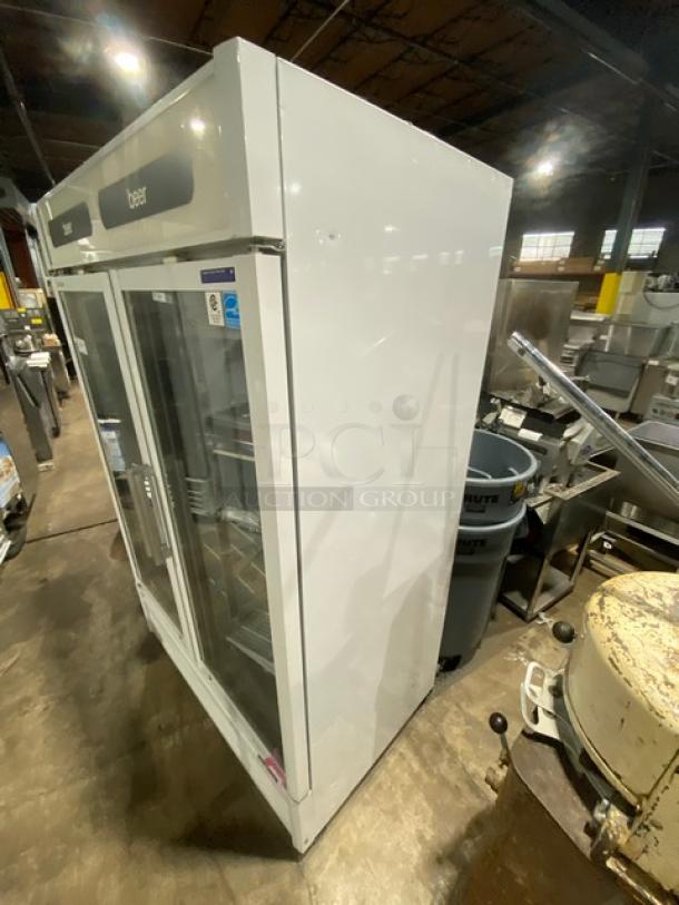 Turbo Air TGM-47SDW commercial refrigerator; white double glass doors, poly coated racks, on casters; Energy Star certified.