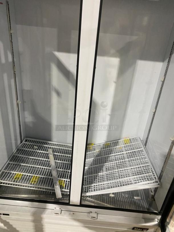 Turbo Air TGM-47SDW refrigerator, double glass doors, on casters, poly-coated racks, Energy Star certified, commercial use.