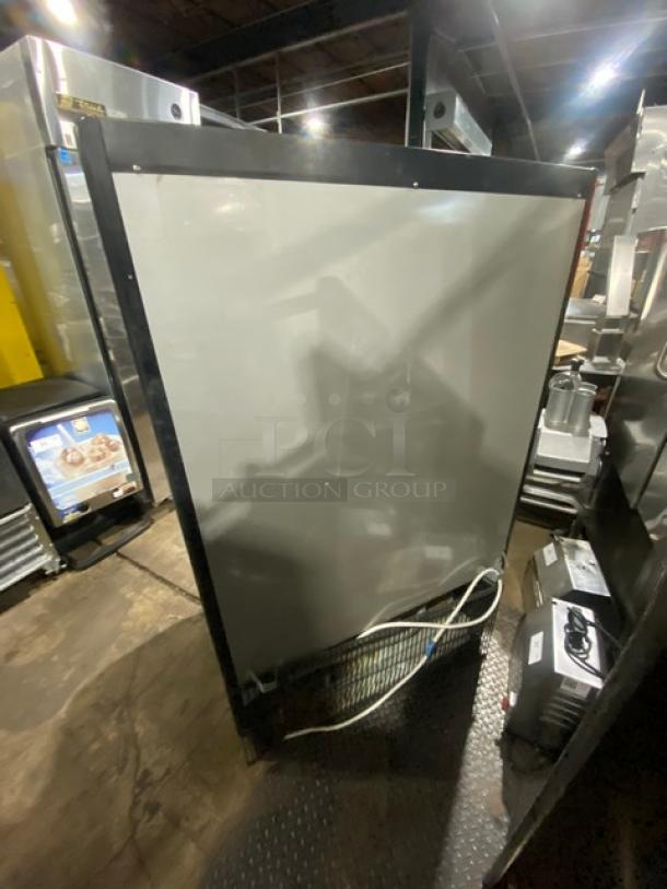 Turbo Air TOM-40M(B) black stainless steel refrigerated merchandiser, multi-tier, 120V, visible control panel and plug.