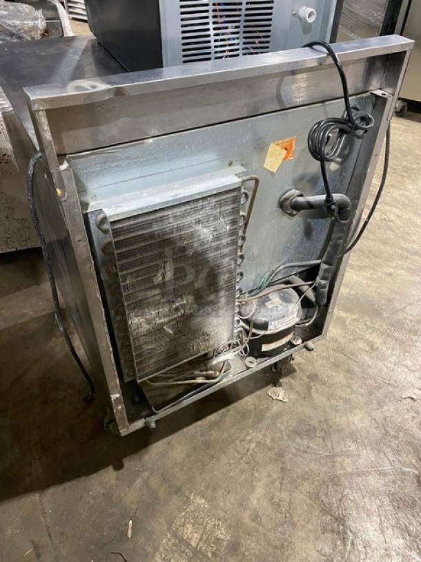 Delfield Enodis Series Model 402 stainless steel worktop refrigerator with upturned backsplash, on casters, in used condition.