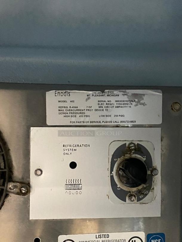 Delfield Enodis Series Worktop Refrigerator, stainless steel, single door, upturned backsplash, model 402, 115V, on casters.